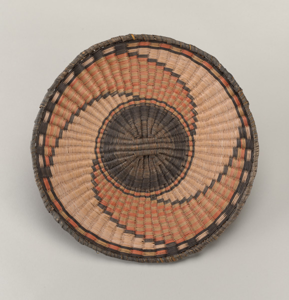 Plaque with whirlwind design