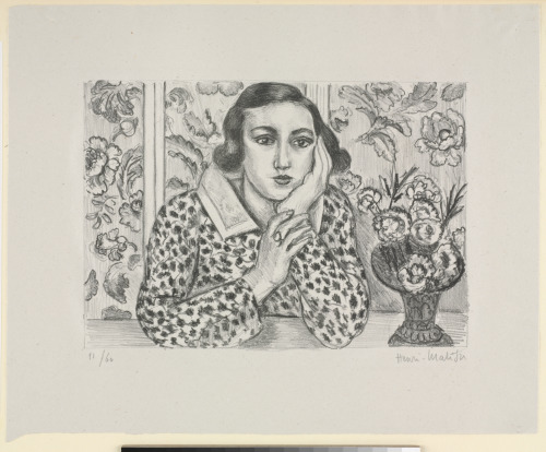 GIRL LEANING ON ELBOWS WITH FLOWERED SCREEN