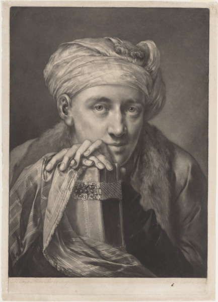 MAN WEARING A TURBAN, LEANING ON A BOOK