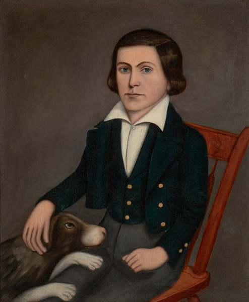 Boy in Red Chair with Dog