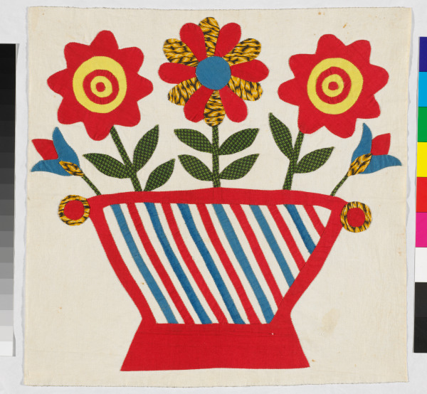 FLOWERS IN RED AND BLUE BASKET