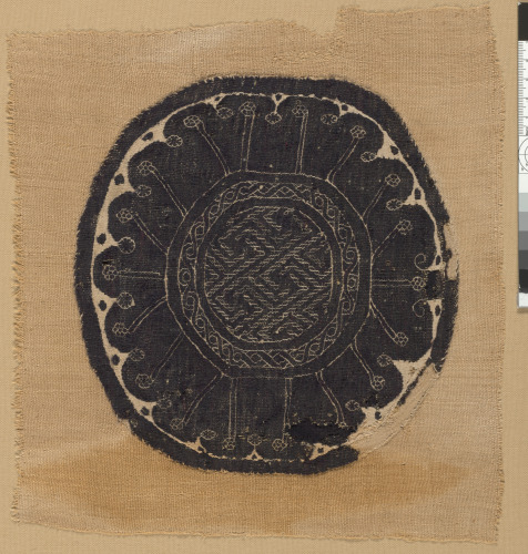 ROUNDEL (ORBICULUS) WITH FRET DESIGNS AND SCALLOPED BORDER