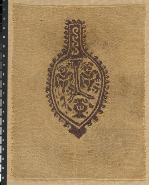 FRAGMENT WITH THYRSUS-SHAPED TUNIC ORNAMENT