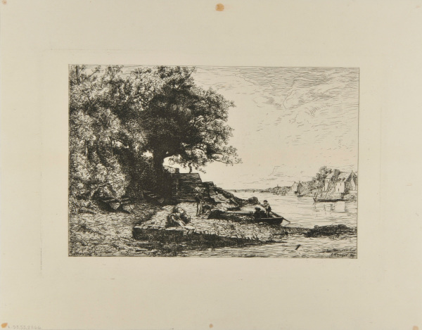 Women washing clothes and men docking a boat on the bank of the river