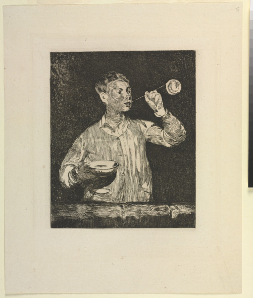 BOY BLOWING SOAP BUBBLES