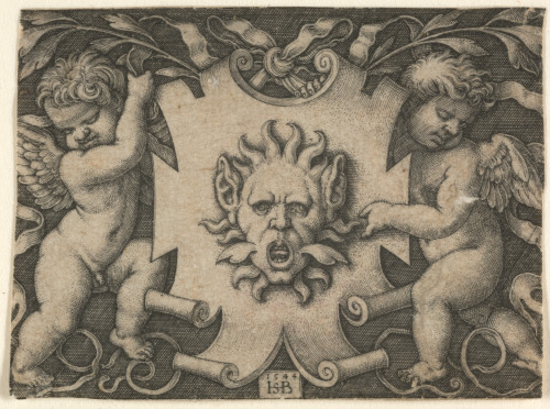 A MASK ON A SHIELD, HELD BY TWO PUTTI