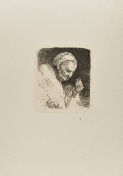 AN OLD WOMAN LOOKING AT A RING