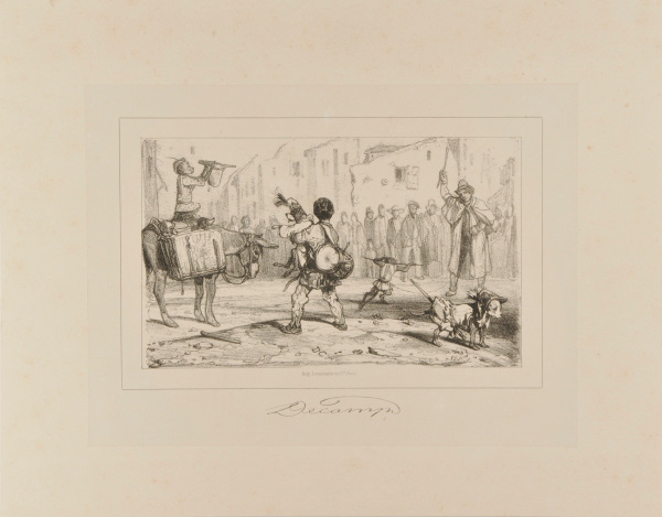 Travelling performer with monkeys and dogs in a town center