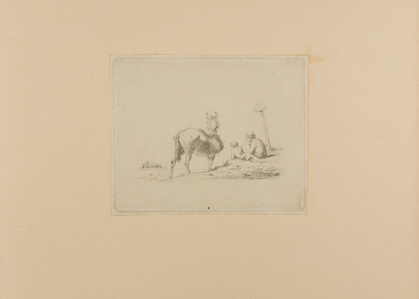 Man and Boy Sitting on Ground Near Donkey with Saddle Bags