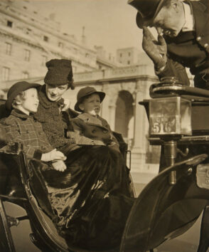 A Woman and Two Children in a Carriage. For Vogue Magazine.