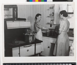 Mrs. Clarence N. Pace Canning English Peas in her Pressure Cooker, with Louise Martin, the Home Management Supervisor, Helping; Transylvania Project, Louisiana, June 1940