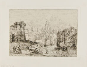 Quai of a small town harbor with fortress to the left