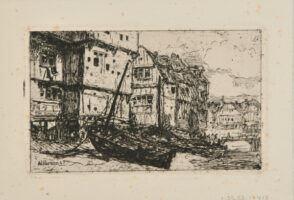 Boats Docked by Houses with Village Bridge in the Background