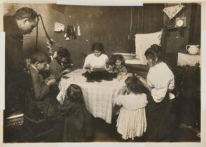 Father Hanging Around the Home While Family Works on Feathers